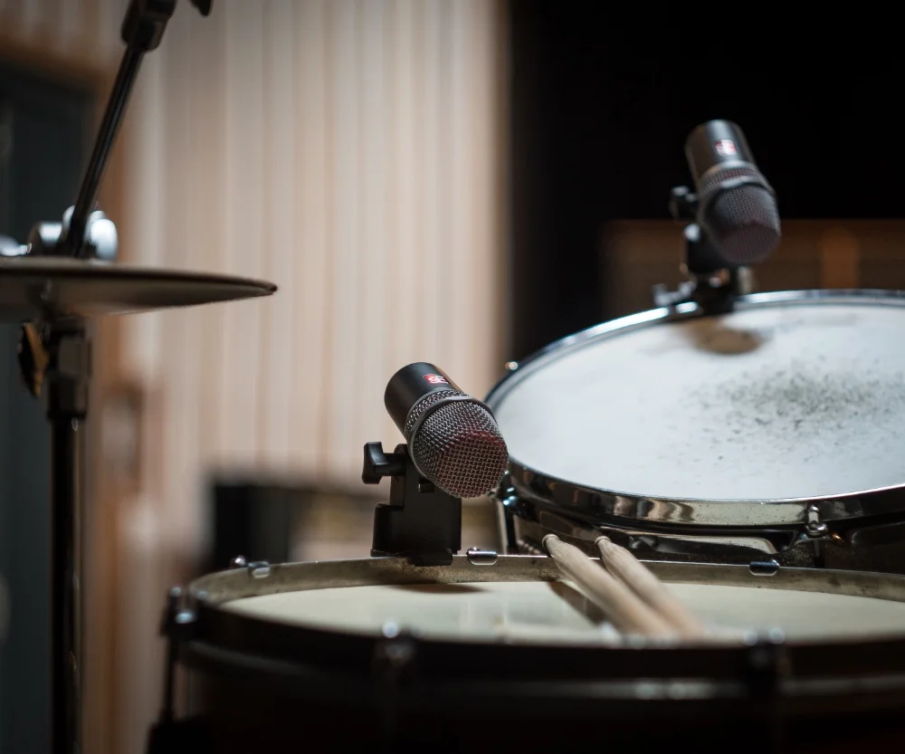 A close up of a drum set in a recording studio showcasing the art of EQing Toms for the ultimate drum sound.
