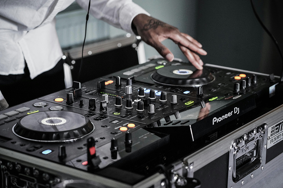 a person playing music on a dj console